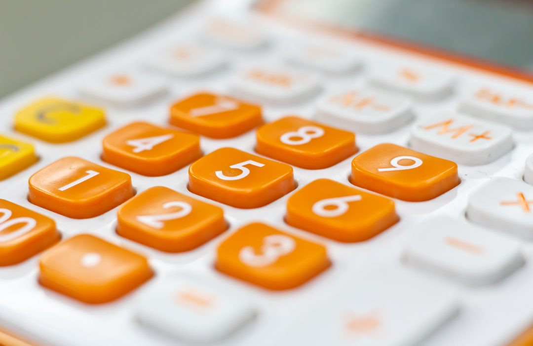 white and orange calculator