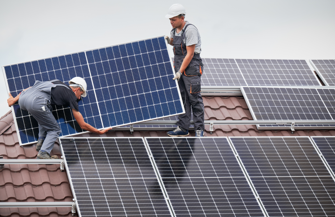 people installing solar panels